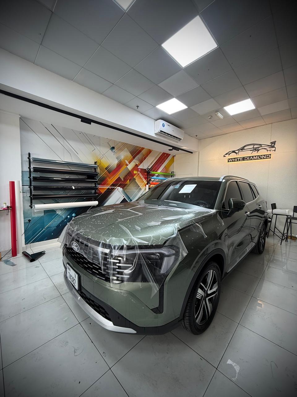 Ford SUV with PPF film being installed at White Diamond
